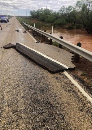 State Hwy. 207 north of Post was closed Thursday afternoon. TxDot worked to repair the highway where water had lifted the asphalt. Photo provided by Crosy Co. SO