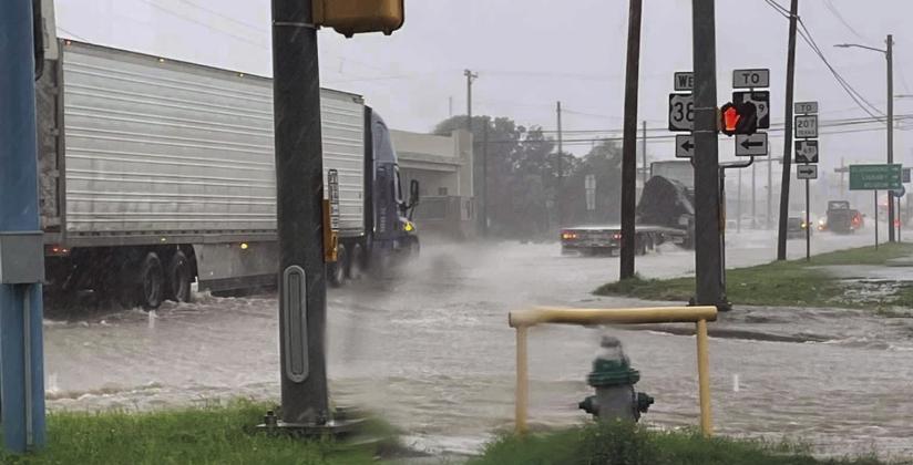 This photo was taken at the intersection of US 84 and West US 380. Wakes caused by traffic driving through the flooded streets caused flooding issued for businesses located on Broadway. Photo Provided