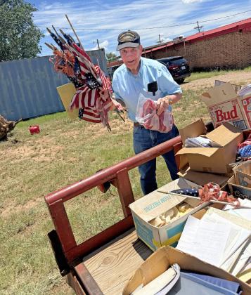 UNFLAGGING RESPECT Post VFW member Tim Lawrence helps with proper disposal of American flags brought to the organization throughout the year by schools, pos offices, government institutions, and other organizations and individuals. | LACEY REITER | POST DISPATCH