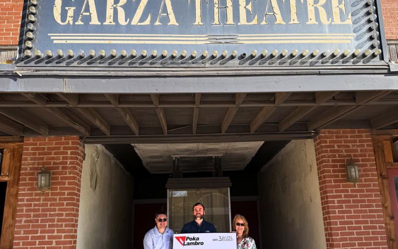 SUPPORTING ITS SECOND CENTURY The Garza Theatre, purchased by Jesse Dixon and Perky Palette two years ago after sitting vacant for a decade, is on its way to a fresh lease on life thanks to seed gifts such as Poka Lambro’s donation earlier this month. Poka Lambro CFO Matt Snowden made the presentation to Angela Dixon and Sean Robertson, Perky Palette representatives. | COURTESY PHOTO