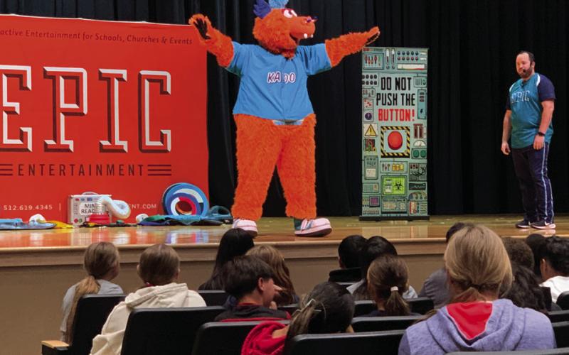 EPIC MINISTRIES Daniel Monplaisir introduces Kazoo the mascot of EPIC Ministries to Post ISD elementary school students, Wednesday, November 20. Monplaisir teaches valuable lessons through metaphors. | ANNA GIBSON PHOTO