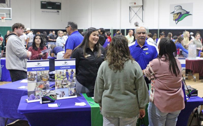 WESTERN TEXAS COLLEGE recruiters Isrell Lawson and Raúl Alcalá speak with prospective students at the 2024 College Fair. | COURTESY PHOTOS