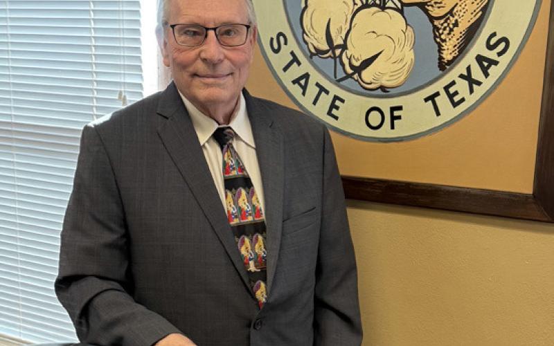 LONGTIME LEADER Judge Lee Norman stands in front of the Garza County Seal as he enters his final year in office, capping nearly two decades of dedicated service and community leadership in West Texas. | STEPHANIE ALLEN