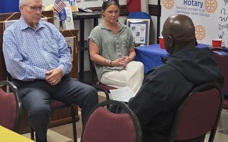 ROLE-PLAYING AT ROTARY Rotarians Terry Jackson, Judge Lee Norman and special guest Traci Jarrett reenact a courtroom sentencing scenario during a Rotary program, depicting a defendant admitting a history of addiction to his spouse before incarceration. | COURTESY PHOTO