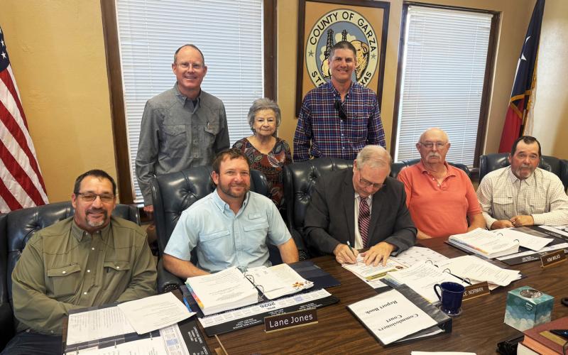COURT PROCLAMATION Garza County Judge Lee Norman signs a proclamation declaring Soil Stewardship Week as Drew Kirkpatrick, Helen Saldaña and Kegan Crouch joined county commissioners for the presentation and signing during commissioners court April 13. | POST DISPATCH