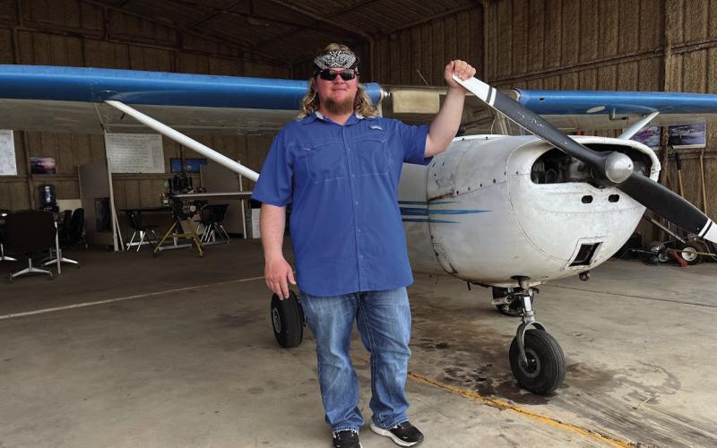 FLIGHT GRADUATE Rowdy T. Wilkinson from Snyder, TX is pictured with the CE-150 airplane. Wilkinson is the second graduate from U.S. Flight Academy in Post, TX by instructor Jarle Boe of Post, TX. On July 23, Wilkinson received his certificate and rate of FAA (Federal Aviation Administration) Private Pilot ASEL (Aircraft Single-Engine Land). ASEL license is a class pilot license that allows the holder to operate single-engine airplanes that take off and land on land. | COURTESY PHOTO