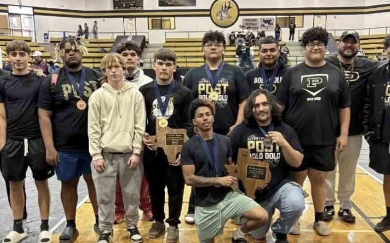 RUNNERS-UP Post High School’s powerlifting team posed with the regional runner-up trophy Saturday in Post. The team finished second overall at the regional powerlifting meet, earning multiple individual honors and advancing lifters to the state meet. | COURTESY PHOTO