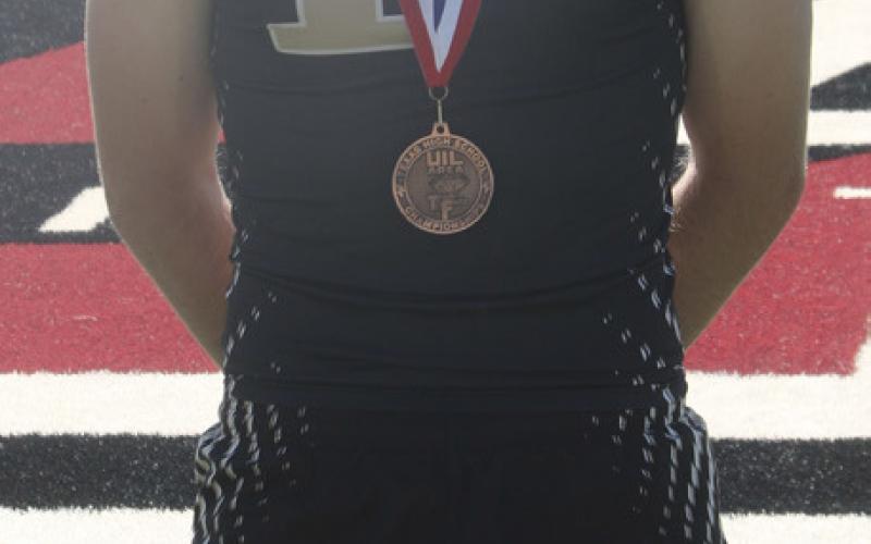 BOLD GOLD Carter Petty with his medal after finishing fourth in the 800-meter run at the area meet to qualify for the Region 1-2A Track Meet. | MINGO SOTO