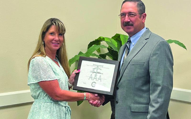Danya Peterson was recognized for Excellence in Extension for outstanding and measurable programs by an agent with less than five years of experience. Peterson is the Garza County Extension and represents South Plains – District 2 AgriLife Extension. She received her award from Rogelio Mercado, Texas County Agricultural Agents Assoc. President. Photo Provided