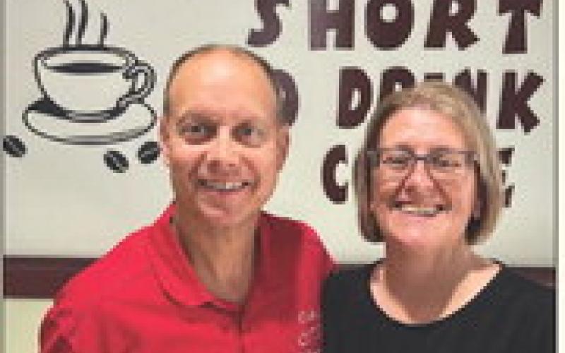 COFFEE WIZARDS Jeff and Dawna Hood, owners of Coffee Wizards, are celebrating the fifth year on North Broadway with a community giveaway on Monday, June 9. Stop by to spin the prize wheel, enter to win merch, and catch the live drawing on Facebook at 3 p.m.! See the article for details. | COURTESY PHOTO