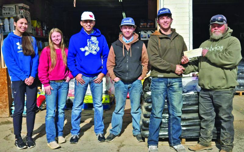 BUCK WINNER DONATION After Evan Botsford of Lubbock was named the Overall and Bow Winner of the 2024-25 Big Buck contest, he donated is $1,000 cash prize to the Spur FFA Booster Club. | COURTESY PHOTO