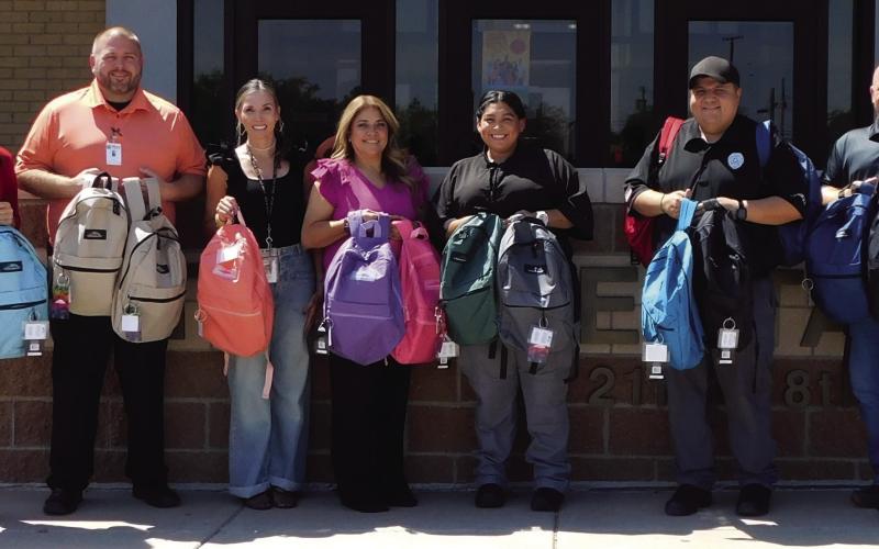 BACKPACKS Employees with Management and Training Corporation (MTC) delivered backpacks to Post Elementary last week. Twentyone backpacks were delivered filled with school supplies. Picture from the left Shawn Lamb, Elementary Principal, MTC Captain David Dyer, Stephanie Valdez, Elementary Social Worker, MTC Admin. Assistant Teresa Gomez, SIS Marina Abrera, SIS Joe Ramirez and Joey Hannaway, Elementary Assistant Principal. | PHOTO PROVIDED
