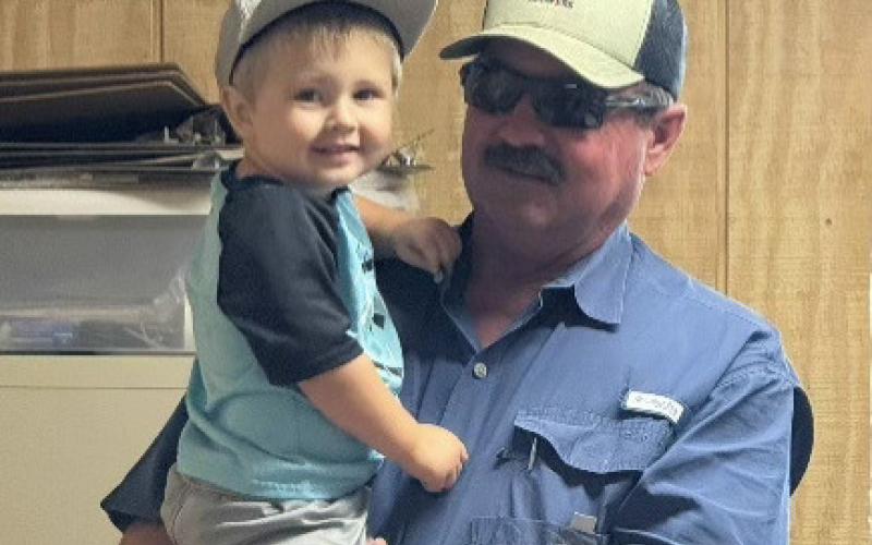Ray Mason with his grandson Nash Mason working hard in the office.