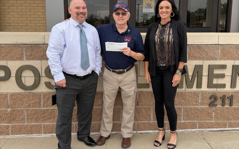GIVING BACK Larry Williams (center), representing the Texas South Plains Honor Flight, accepted a donation check from Assistant Principal Joey Hanaway and Principal Shawna Lamb during a presentation May 20 at Post Elementary School. | STEPHANIE ALLEN
