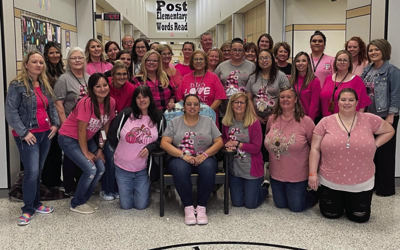 At Post Elementary no one fights alone. We are with you Angela Simpson. All the staff wore pink to show their support as Angela Simpson returns to work after being out with breast cancer treatment. Angela is the early childhood special education specialist. Photo by Voda Beth Gradine