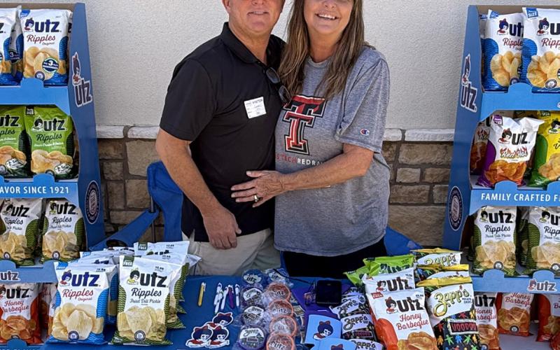 SNACK GIVEAWAY Davey and Tanya Rhodes of Utz handed out chips and other freebies to customers during Casey’s grand opening in Post. | STEPHANIE ALLEN