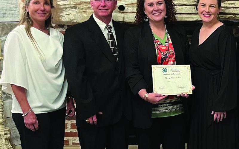 HONORED Kerry and Kristi Wink were presented as the District 2 Garza County 4-H Distinguished. From left to right: Danya Peterson, Garza County Extension, Kristi and Kerry Wink, and Xane Reiter, Garza County Family and Community Health Agent. Also attending the event were County Judge Lee and Marsha Norman, and Carol Williams. | PHOTO PROVIDED
