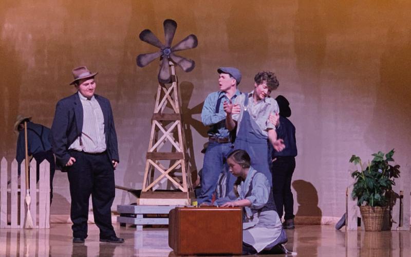 ON STAGE The Diviners One Act Play was performed by the Post High School students during the District Competition Tuesday. The Layman family welcomes C.C. Showers to their home. Pictured is Jonah Pequeno playing C.C. Showers, Branson Harris playing Ferris Layman, Maxximus Cole playing Buddy Layman, and Harli Jo McClellan playing Jennie Mae Layman. | POST DISPATCH PHOTO