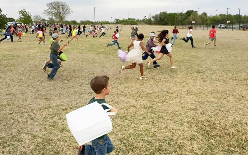 EGG HUNT Children race across the grass at Post City Park, eagerly collecting colorful eggs during the community Easter egg hunt hosted by Caprock Springs Fellowship on April 3. | COURTESY PHOTO