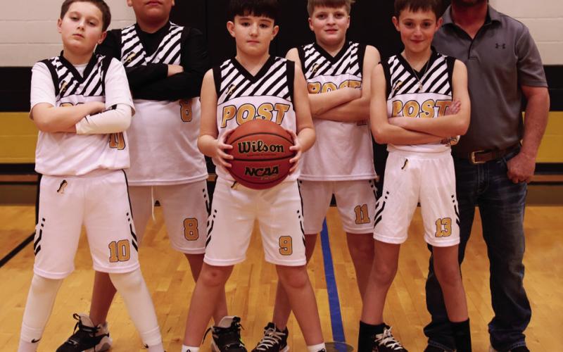 Boys 5th/6th Coach Bradley Whisenhunt, Sponsor Suber ESP Solutions, and players Xzavious Luna-Ward, Eli Perez, Paxton Matus, Charlie Cotton, Aaron Brooks, Bryson Bloomingdale, and Jaiden. | WHITNEY DORSETT PHOTO
