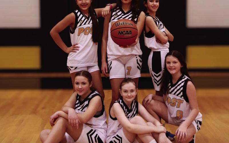 Girls 5th/6th Coach Daniel Redman, Sponsor Rafter R Ranch, and players Lyncolnn Lot, Olivia Abraham, Maegan Redman, Maylen Mendez, Ella Smith, Harper Menjares, and Cora Garrett. | WHITNEY DORSETT