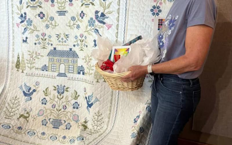 PEOPLE’S CHOICE Joann Travis took the People’s Choice award for her cross-stitch quilt, which she made in her twentiess and was later quilted by a neighbor, during the Garza County Quilt Show on Saturday, May 2, in Post. | COURTESY PHOTO