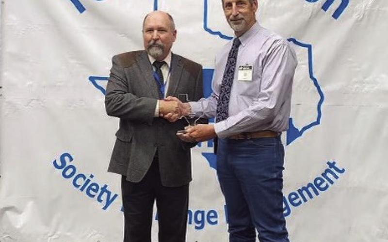 NCRS HONORS Doug Tolleson, President of the Texas Section Society for Range Management (TSSRM), presents the 2023 Grass Roots NRCS award to Range Conservationist Glen Killough of Post, Texas, at the TSSRM annual meeting held in Bastrop, Texas. | COURTESY PHOTO