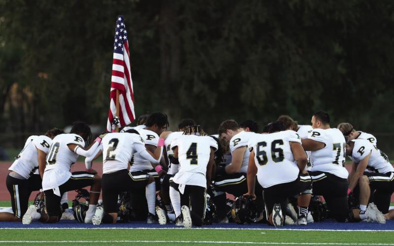 The Bold Gold Antelopes take a moment of silence before facing the Sundown Roughnecks in Week 9 action last Friday.