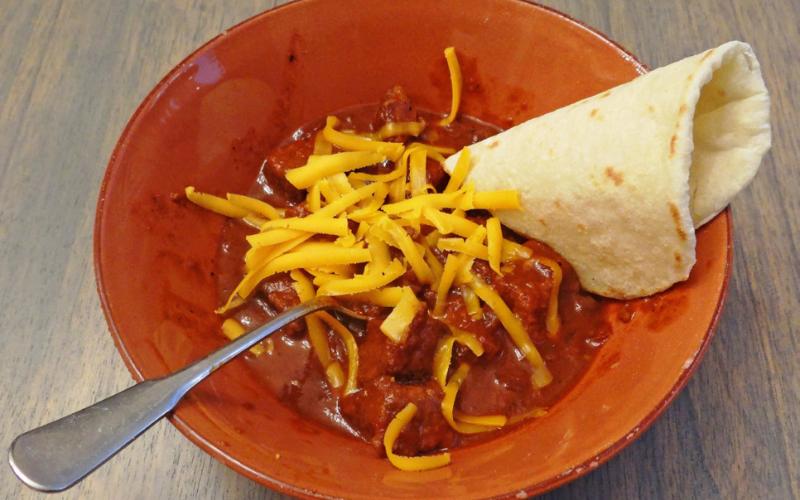 BIG, BEEFY CHUNKS OF BRISKET will satisfy the hungriest folks, in this make-ahead chili that slowly cooks in the crockpot while you’re busy watching the big game, or movies with your family. | ANGELINA LaRUE PHOTO