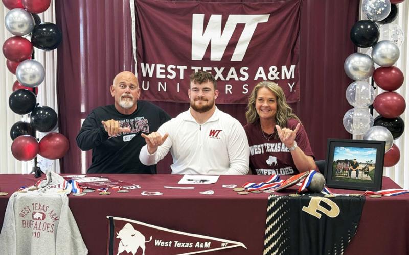 Post High School senior Mason Wright (center) signed April 23 to compete in discus, shot put and hammer at West Texas A&amp;amp;M University, joined by his parents, John and Mechelle Wright. Wright is a four-time state track and field qualifier. | COURTESY PHOTO