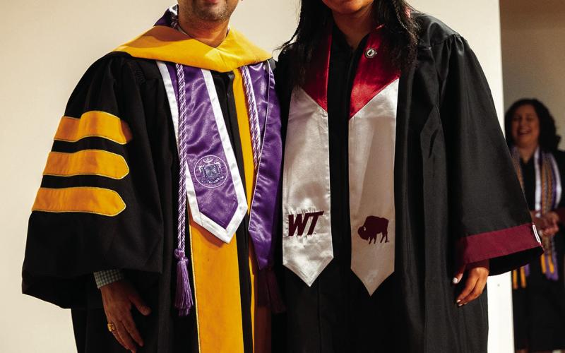 PINNING CEREMONY Marti Cruse stands with Shravan Devkota, WT’s Dr. Wesley L. Langham Professor of Nursing after the nursing pinning ceremony. | COURTESY PHOTO