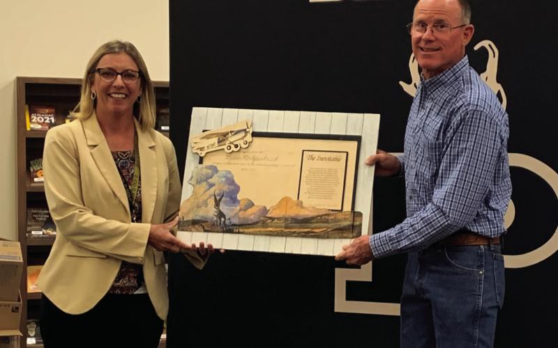 15 YEARS OF SERVICE Drew Kirkpatrick was honored with a personalized handcrafted wall decor at his last school board meeting, Monday, April 7, for his 15 years of service on the Post ISD school board. | ANNA GIBSON PHOTO