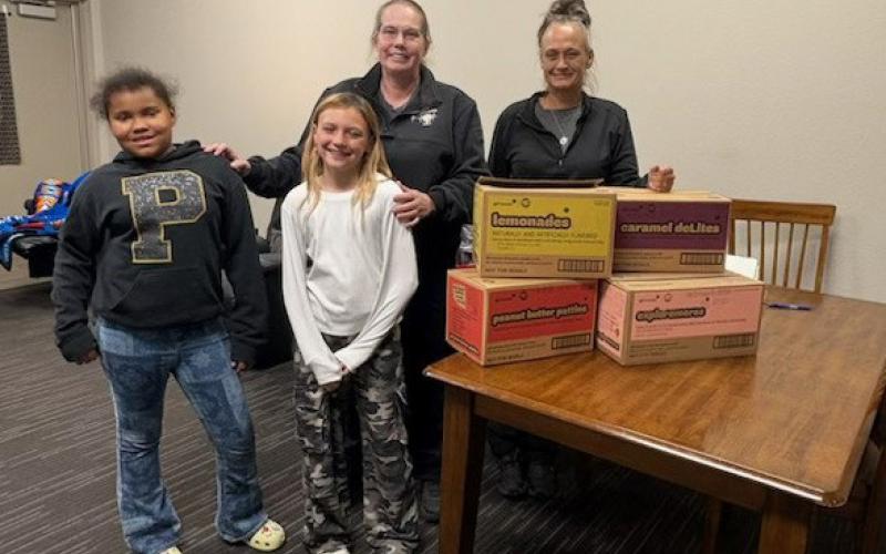 SWEET THANKS Dezariyah Spann and Averie Howell presented Girl Scout cookies to Post EMTs Amanda Hair and Mandi Thompson April 20 as a token of appreciation for their service. See more photos on page 4. | COURTESY PHOTO