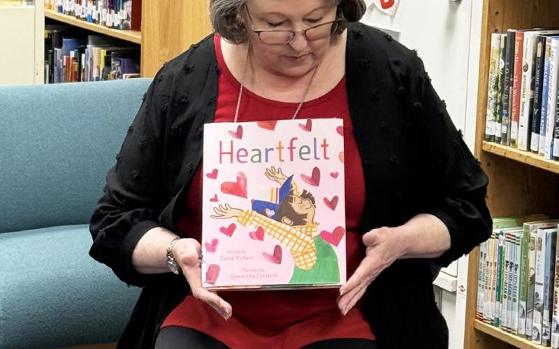 HUGS FOR HEAD START Post librarian Pam Humble welcomed Windham Head Start students Wednesday with festive stories and activities. | POST DISPATCH