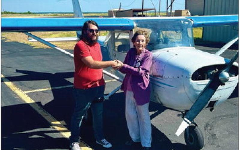 Dillon C. Lloyd is with Designated Pilot Examiner Rosemary Stidham and received his private license this week. Lloyd is the first graduate of the US Flight Academy in Post. PHOTO PROVIDED