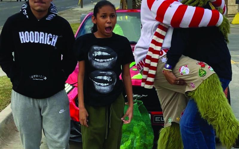 THE GRINCH The WTX Grinch came to Post Monday, December 2. He stopped at McDonald’s from 4 p.m. - 5 p.m. for free pictures. A few locals made their way and took some photos. You may find more photos on page 6 | PHOTOS PROVIDED