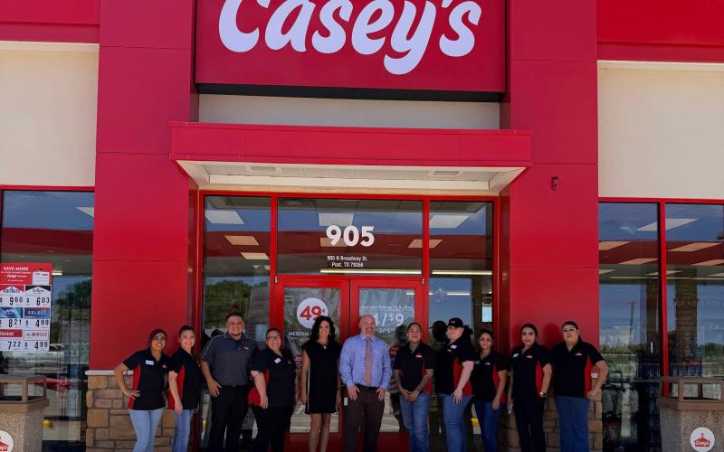 COMMUNITY SUPPORT Employees of Casey’s and Post Elementary School officials pictured following a $1,000 donation presented during the week of the store’s grand opening, with funds supporting student learning opportunities. | COURTESY PHOTO