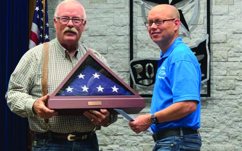 COUNCILMAN RECOGNIZED, Mayor Marvin Self is shown giving a flag that has flown over Post to Councilman Jeff Hood, in recognition by the city after serving five years which started as an appointed position in 2019. | ANNA GIBSON PHOTO