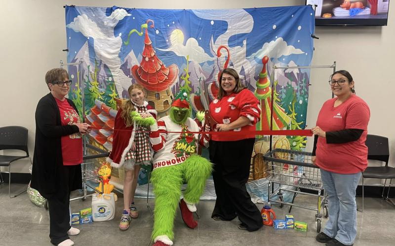 SPECIAL GUIEST Antelope Wash ‘N‘ Dry self-service laundromat celebrated their one-year anniversary in Post Dec. 5 with a special holiday visitor—The Grinch! | COURTESY PHOTO