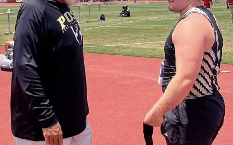 FAMILY LEGACY Post High School senior Mason Wright (right) spent time with his father and coach, John Wright, between shot put throws during the UIL State track and field meet on Friday, May 15 in Austin. | RUSS MORRIS