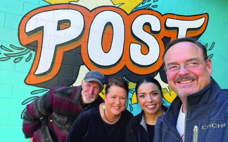 COMMUNITY CENTER City Manager J. Rhett Parker is with Asst. City Secretary Susan Collazo, City Secretary Meg Nelson and City Animal Control and Code Enforcement Officer Eddie Pitts pose in front of the new mural at the Post Community Center. The mural is located in the courtyard at the east entrance of the building and was painted by Street Artist Calina Mishay Johnson. | PHOTO PROVIDED