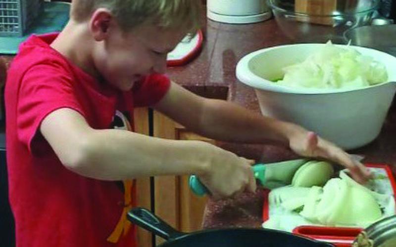 4- H COOKING The Garza County 4-H club now has a second cooking challenge team who will be competing with other counties on November 5 in Levelland. Samuel Gibson is shown slicing an onion.The new team consists of Samuel Gibson, Philemon Gibson, and E. J.Webb. Their instructor is Paul Gibson. | PHOTO PROVIDED