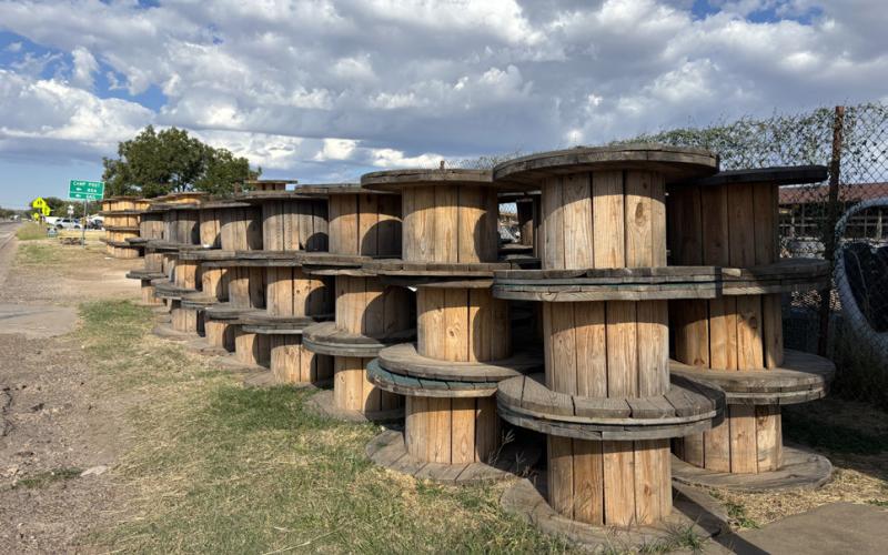 EMPTY SPOOLS were stacked after the large safety barrier project on Highway 84. The spools sit and wait for a truck to collect. | PAULA JACKSON PHOTO