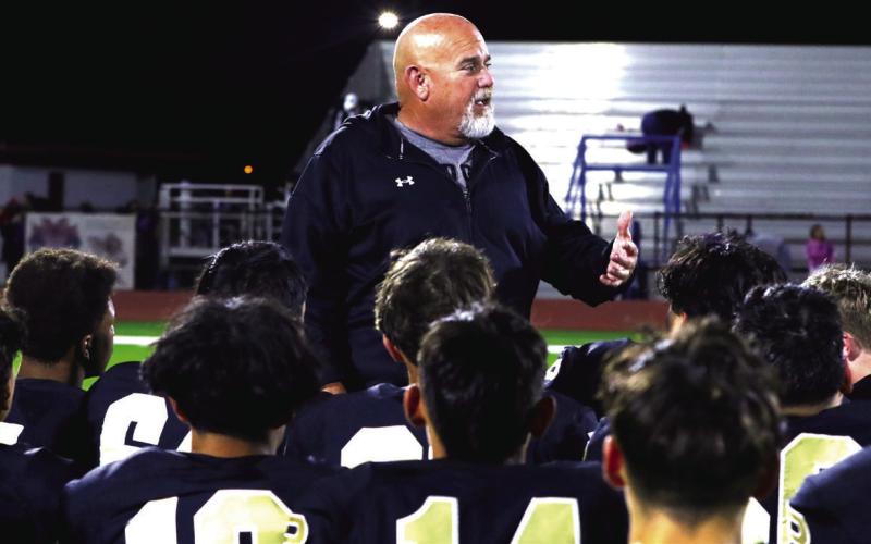 BI-DISTRICT CHAMPS Head coach John Wright commends the team after a 'tale of two sides' type of game. | KHLOE SMITH PHOTO