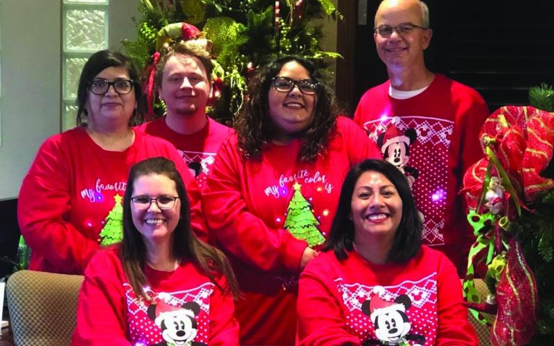 OPEN HOUSE Peoples Bank held their annual Christmas Open House last week. Employees greeted guests throughout the day, including (seated) Stormie Lawrence and Sierra Guerrero. Standing Raquel Britton, Reid Banta, Rubi Ann Rodriquez and Clay Miller. | PHOTO PROVIDED