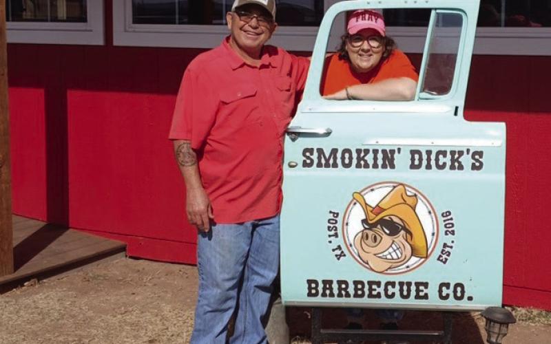 BARBECUE HAVEN Dick and Shellee Odom stand beside their restaurant sign with great big smiles after their newly constructed addition to Smokin’Dick’s Barbecue. They will celebrate their third year on Feb. 14 with a pork chop meal deal from 11 a.m. - 6 p.m. | PAUL GIBSON PHOTO
