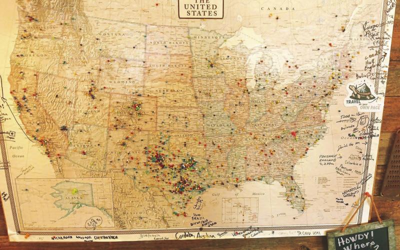 AMERICA LOVES BBQ On the wall in Smokin’ Dick’s Barbecue hangs a large map filled with pins that specify just where folks have come from to eat barbecue in Post. Dick and Shellee Odom are amazed at the stories told and the friends made from folks that come from far and near. | PAUL GIBSON PHOTO