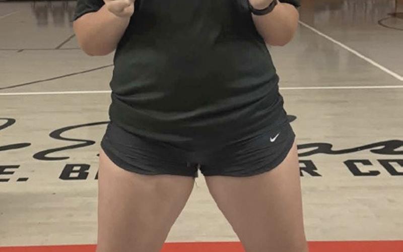 DOUBLE GOLD Audrey Lee of Southland High School celebrated a dominant performance at the district track meet, earning gold in both the shot put and discus to advance to the area competition. | COURTESY PHOTO