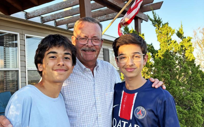 EXCHANGING WORLDS Local resident Jay Young, center, is a link for students to experience West Texas. Jules, right, is a sophomore from Toulouse, France, and Davi, a junior from Brazil, are attending Post High School for one year. The students sought the exchange program for independence and to experience a new culture. | PAULA JACKSON