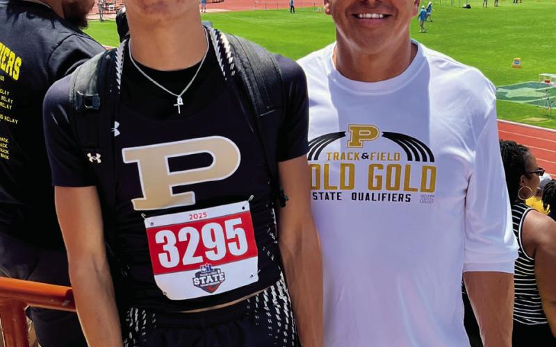 STATE QUALIFIER Assistant coach Zach Ramos stands proudly with his son, Sean Ramos, who placed 7th in the 200m dash at the 2A State Track Meet, marking a memorable finish to a strong junior season. | RUSS MORRIS PHOTO
